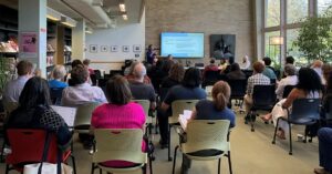 Panelists and audience at Burling Lounge event